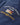 Close-up of embroidered Henri-Lloyd Round the World Race logo patch on sleeve of waterproof jacket.