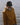 Person wearing Henri-Lloyd waterproof jacket and cap standing near water
