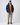 Full-body shot of model wearing Henri-Lloyd Consort Riviera Jacket with casual trousers, sweater and cap.