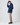 Side profile of model wearing Henri-Lloyd Consort Riviera Jacket with collar up and hands in pockets.