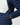 Navy insulated jacket with contrast cream chest panel and side pocket detail.