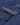 Detailed view of the chest pocket on the Men's Aston Crew Jacket showing embroidered Henri-Lloyd logo and zip pull.