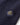 Henri Lloyd crest patch on navy cable knit sweater sleeve.