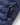 Close up of navy insulated jacket pocket with Henri Lloyd branded zip pull.
