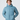 Front view of hooded light blue insulated jacket with hands in pockets.