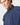 Close-up of model wearing a men's sailing smock, showing high collar with Velcro fastening and partial front zip.