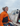 Jazz Turner, on a boat, wearing an orange insulated sailing jacket