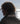 Henri Lloyd Jib jacket collar detail overlooking calm sea with sunlight reflection.